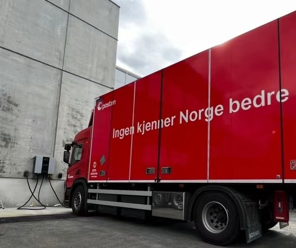 A charging installation beside a commercial vehicle bay.