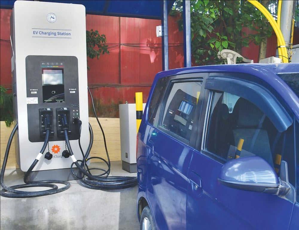 EV charging equipment installed alongside a passenger vehicle.