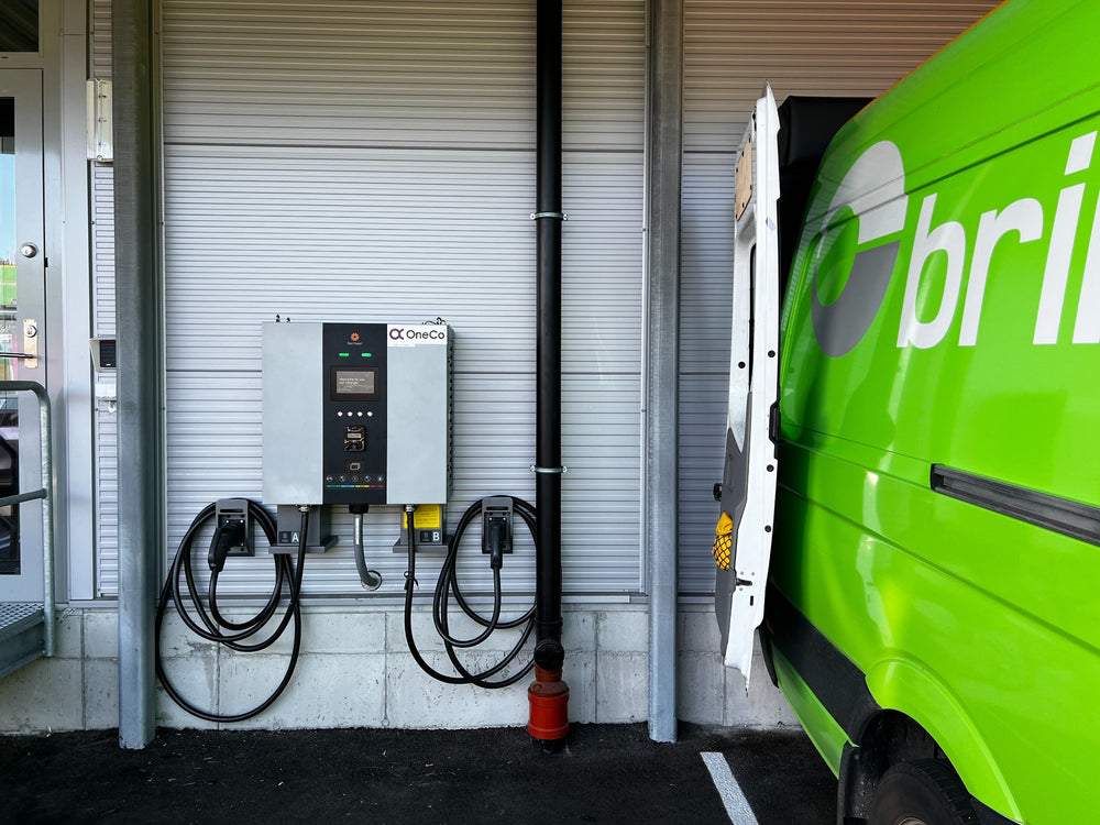 A closer view of charging equipment beside a commercial vehicle.
