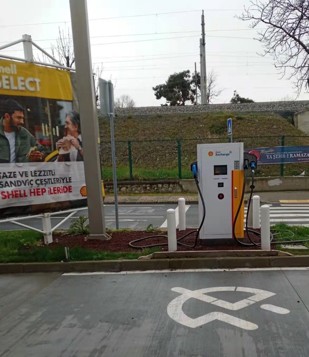 A marked EV bay with charging equipment beside the parking space.