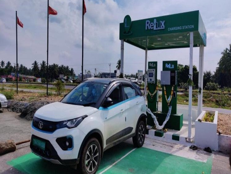 An EV parked at a dedicated outdoor charging station.