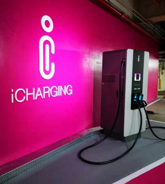 A close view of the charging unit within an indoor product showcase.