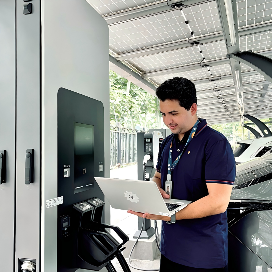 On-site equipment checks beside an installed EV charger.