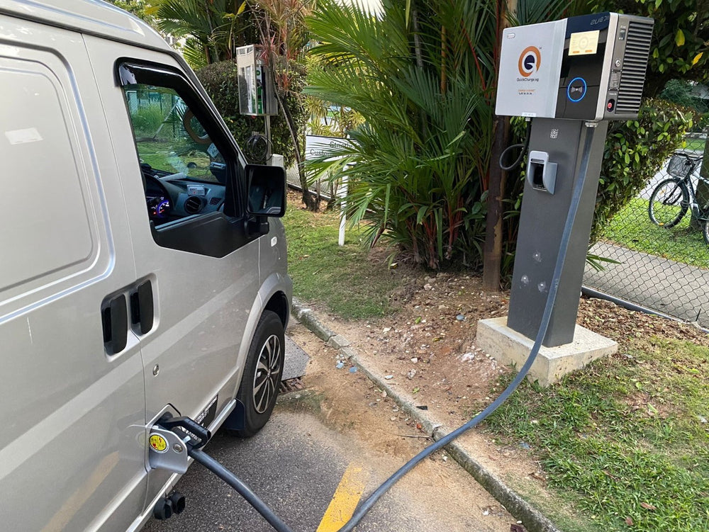 Commercial vehicle connected to an EV charger in Singapore